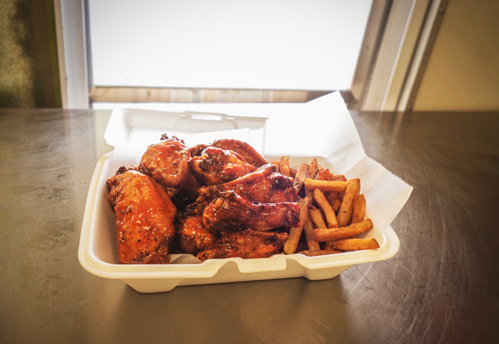 Raytays sauced wings and golden fries